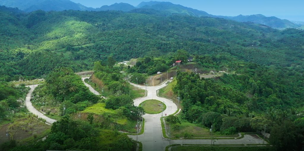 Aerial view of the completed roads and rolling terrain at Foressa Mountain Town, Balamban, Cebu